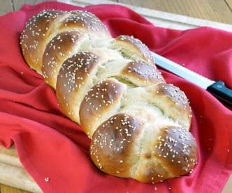 The Jewish braided bread, Challah, is light and fluffy egg bread with a glowing crust. It is perfect for special celebrations, weeknight dinners, and everything in between. | www.CuriousCuisiniiere.com