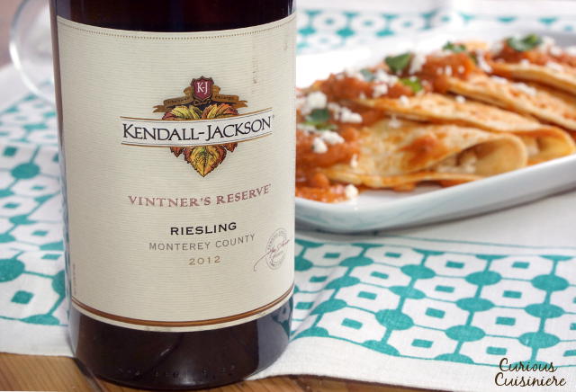 Chicken and Cheese Entomatadas are a chili-less version of enchiladas that uses the sweetness of tomatoes to create a fun and flavorful dish. | www.CuriousCuisiniere.com