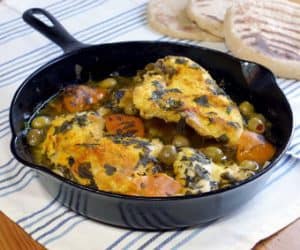 Moroccan Preserved Lemon Chicken Tagine brings fall-off-the-bone tender chicken together with a bright flavor from preserved lemons and a savory burst of green olives. | www.CuriousCuisiniere.com