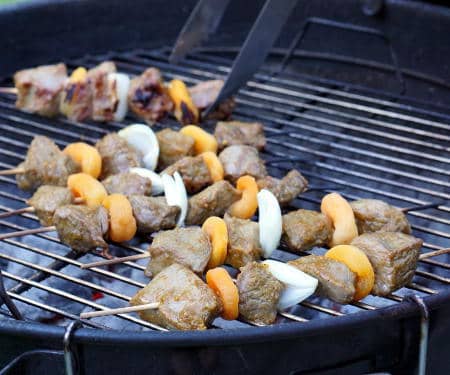 Sosaties are South African kebabs marinated in a sweet curry sauce. Our beef version is tender, lightly caramelized, and everything you want in a summer barbecue recipe. Perfectly paired with a South African Pinotage wine. | www.CuriousCuisiniere.com