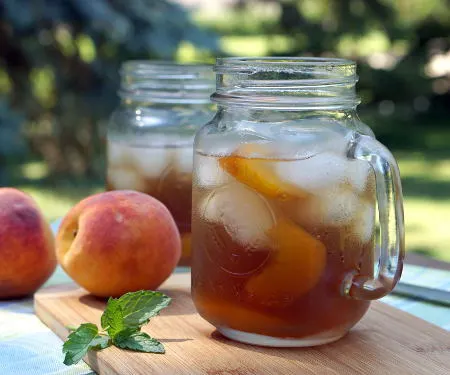 This lightly sweet Vietnamese Peach Tea is made with real peaches for a perfectly refreshing summer drink! | www.CuriousCuisiniere.com