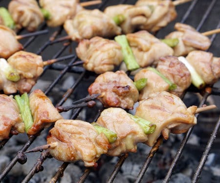 Negima Yakitori are tender and juicy Japanese chicken skewers that feature a sweet and salty glaze and are grilled to perfection. Get ready to kick your next backyard BBQ up a notch! | www.Curious Cuisiniere.com