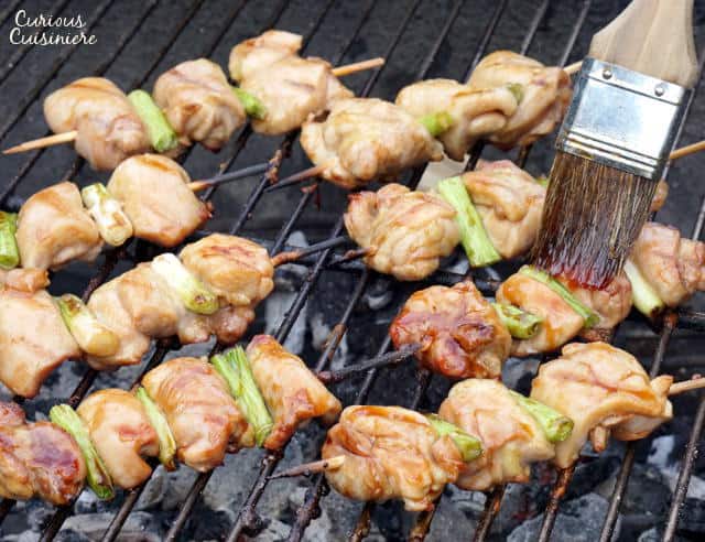 Negima Yakitori are tender and juicy Japanese chicken skewers that feature a sweet and salty glaze and are grilled to perfection. Get ready to kick your next backyard BBQ up a notch! | www.Curious Cuisiniere.com 
