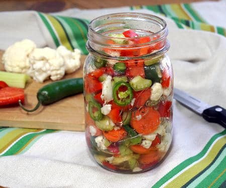 Our homemade Giardiniera recipe gives you the freedom to choose your level of heat. These Italian pickled vegetables are the perfect, crisp sandwich topper and much more! | www.CuriousCuisiniere.com