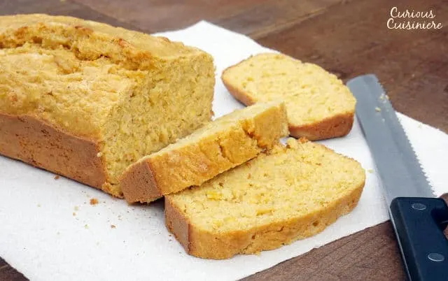 Kernels of sweet corn stud this sweet and flavorful Mealie Bread, a South African sweetcorn bread that is sure to delight any cornbread fan. | www.CuriousCuisiniere.com