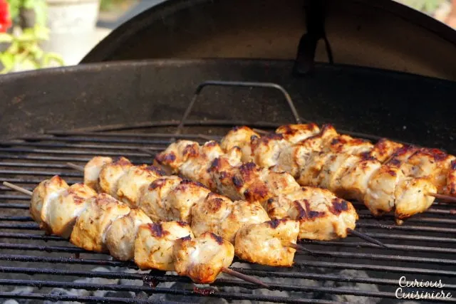 Lemon and garlic bring a burst of flavor to these grilled chicken skewers. Middle Eastern Shish Tawook will make a great addition to your next cookout! | www.CuriousCuisiniere.com