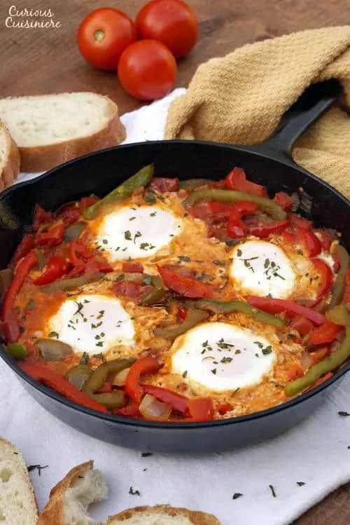 An easy yet hearty African dish of eggs in a fragrant tomato sauce, Chakchouka, also known as Shakshuka, is the perfect, comforting dinner recipe. | www.CuriousCuisiniere.com