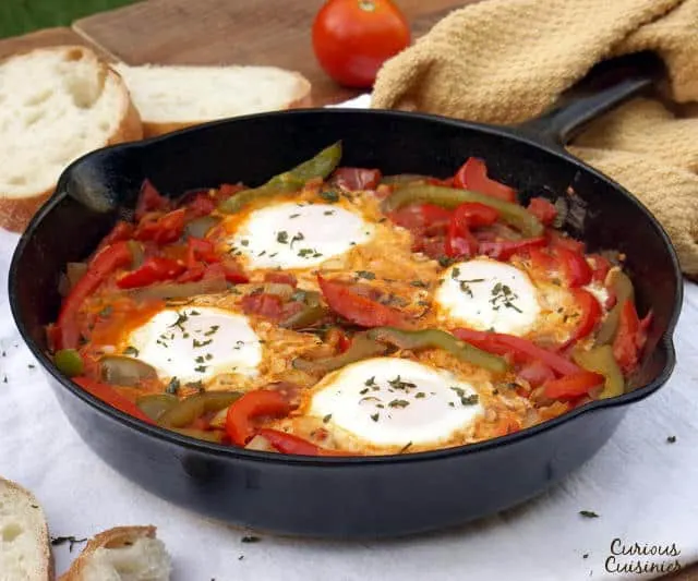 An easy yet hearty African dish of eggs in a fragrant tomato sauce, Chakchouka, also known as Shakshuka, is the perfect, comforting dinner recipe. | www.CuriousCuisiniere.com