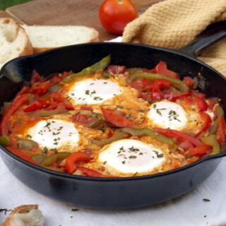 An easy yet hearty African dish of eggs in a fragrant tomato sauce, Chakchouka, also known as Shakshuka, is the perfect, comforting dinner recipe. | www.CuriousCuisiniere.com