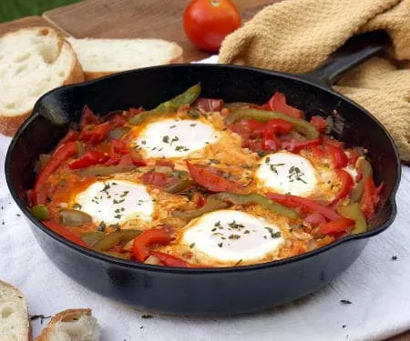 An easy yet hearty African dish of eggs in a fragrant tomato sauce, Chakchouka, also known as Shakshuka, is the perfect, comforting dinner recipe. | www.CuriousCuisiniere.com