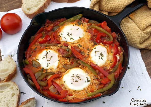 An easy yet hearty African dish of eggs in a fragrant tomato sauce, Chakchouka, also known as Shakshuka, is the perfect, comforting dinner recipe. | www.CuriousCuisiniere.com