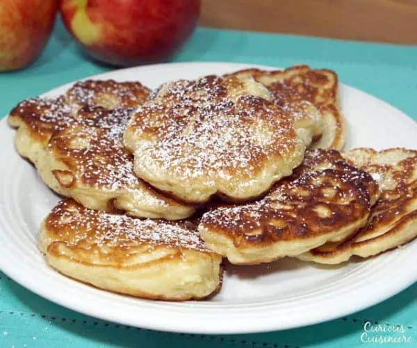 Crispy on the outside, sweet and fluffy on the inside, these Polish apple pancakes are sure to become a fall treat! | www.CuriousCuisiniere.com
