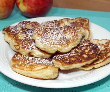 Crispy on the outside, sweet and fluffy on the inside, these Polish apple pancakes are sure to become a fall treat! | www.CuriousCuisiniere.com