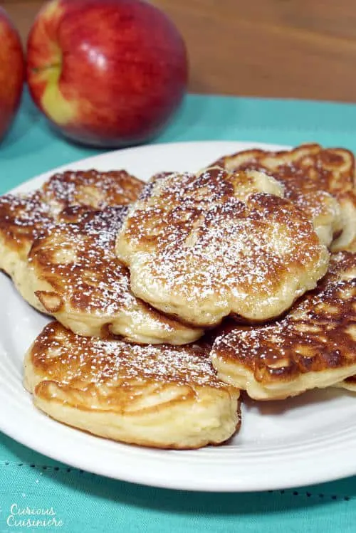 Crispy on the outside, sweet and fluffy on the inside, these Polish apple pancakes are sure to become a fall treat! | www.CuriousCuisiniere.com