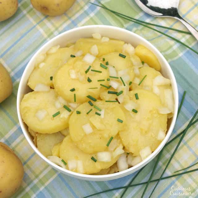 Tangy and sweet Schwabischer Kartoffelsalat, is flavorful German Potato Salad, perfect for your next cookout or picnic, or for celebrating Oktoberfest. | www.CuriousCuisiniere.com