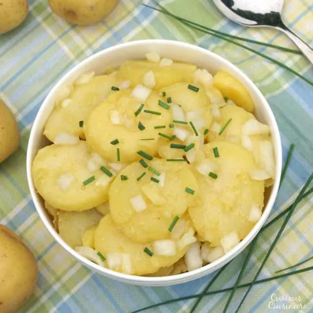 Tangy and sweet Schwabischer Kartoffelsalat, is flavorful German Potato Salad, perfect for your next cookout or picnic, or for celebrating Oktoberfest. | www.CuriousCuisiniere.com