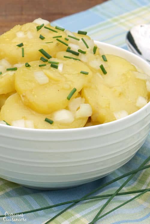 Tangy and sweet Schwabischer Kartoffelsalat, is flavorful German Potato Salad, perfect for your next cookout or picnic, or for celebrating Oktoberfest. | www.CuriousCuisiniere.com