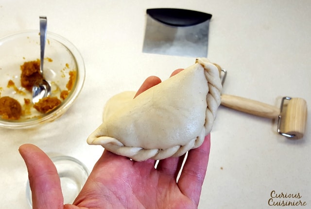 Lightly sweet and full of pumpkin pie flavor, these Baked Pumpkin Empanadas are a fun treat for any pumpkin lover! | www.CuriousCuisiniere.com