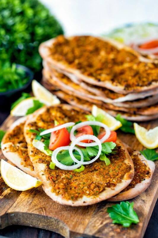 Lahmacun - Turkish Pizza - Topped with onions, tomatoes and lettuce