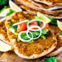 Lahmacun - Turkish Pizza - Thin and crispy pizza topped with a meat and vegetable mixture and rolled with fresh toppings. A perfect street food!