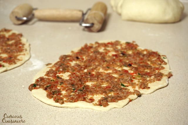 Crispy, flatbread Turkish pizza, Lahmacun, is fun to eat and a great recipe for a party, since everyone can top their own as they desire. | Curious Cuisiniere