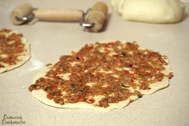 Crispy, flatbread Turkish pizza, Lahmacun, is fun to eat and a great recipe for a party, since everyone can top their own as they desire. | Curious Cuisiniere
