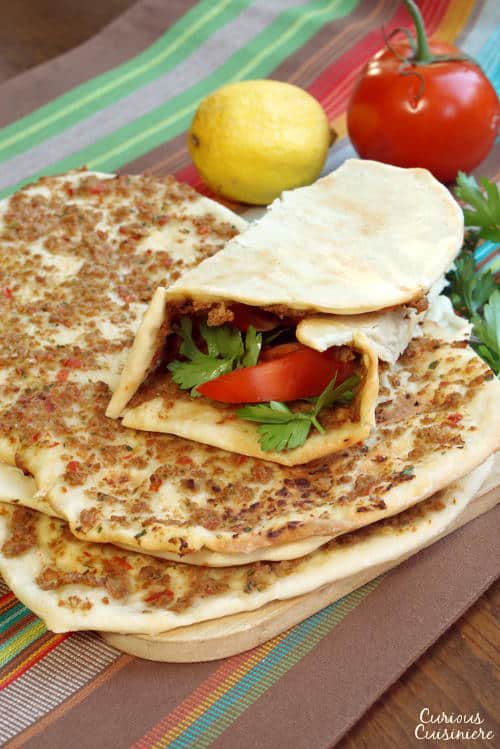 Crispy, flatbread Turkish pizza, Lahmacun, is fun to eat and a great recipe for a party, since everyone can top their own as they desire. | Curious Cuisiniere