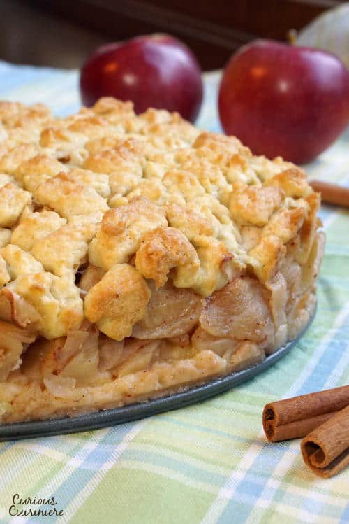 This Szarlotka recipe combines a thick layer of apples with a dense, cake-like crust and a crumble topping, to create a Polish apple pie that is sure to be a fall favorite. | www.CuriousCuisiniere.com