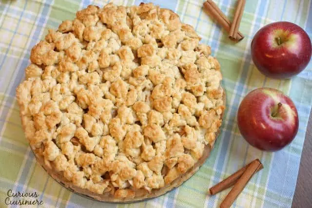 This Szarlotka recipe combines a thick layer of apples with a dense, cake-like crust and a crumble topping, to create a Polish apple pie that is sure to be a fall favorite. | www.CuriousCuisiniere.com