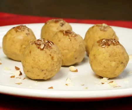 It's easy to make these nutty and sweet, no bake Indian chickpea treats. Besan Ladoo are a perfect gluten free treat to add to a cookie platter! | www.CuriousCuisiniere.com