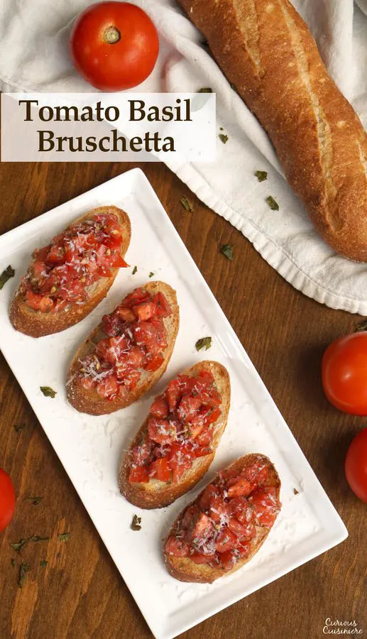 This recipe for a classic Tomato Basil Bruschetta features the perfect, bright and herby tomato topping served over crisp garlic toast. | www.CuriousCuisiniere.com