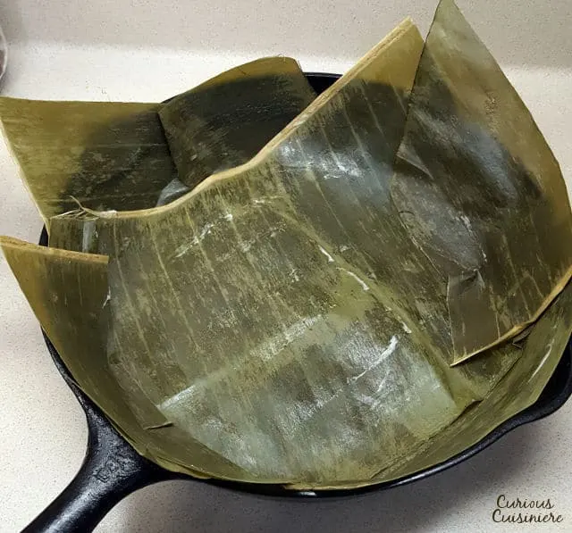 Bibingka is a sweet coconut milk cake that is naturally gluten free! This fluffy Filipino cake uses rice flour to give it a unique texture and delicious flavor! | www.CuriousCuisiniere.com