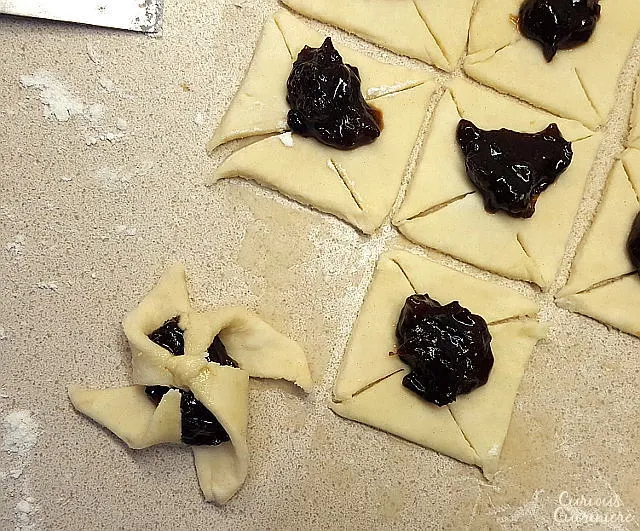 Soft and flaky pasty surrounds a flavorful jam in Joulutorttu, festive Finnish Christmas Star Cookies. | www.CuriousCuisiniere.com