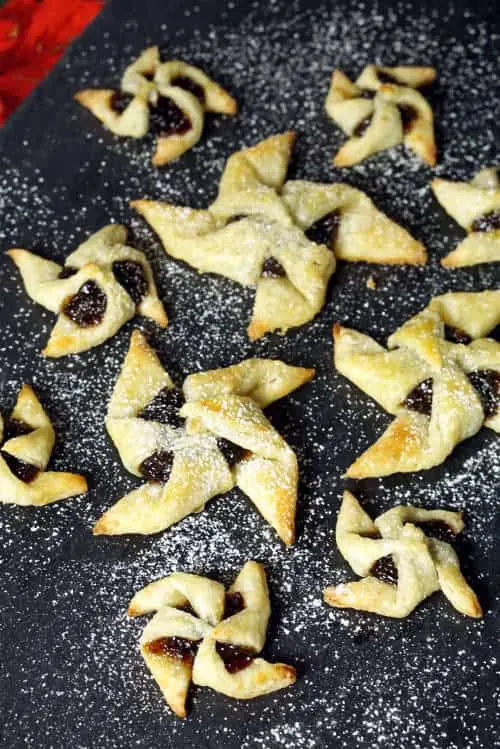 Soft and flaky pasty surrounds a flavorful jam in Joulutorttu, festive Finnish Christmas Star Cookies. | www.CuriousCuisiniere.com