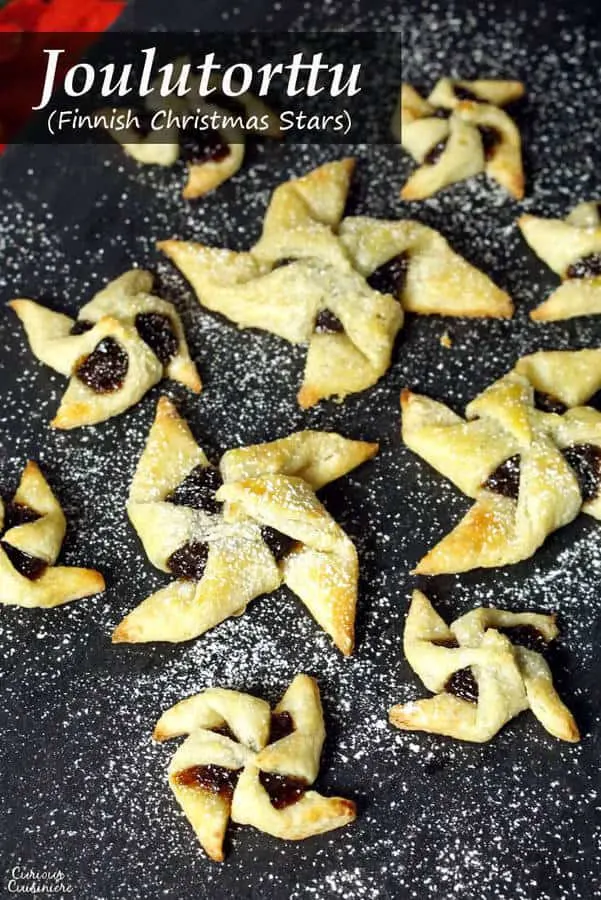 Soft and flaky pasty surrounds a flavorful jam in Joulutorttu, festive Finnish Christmas Star Cookies. | www.CuriousCuisiniere.com