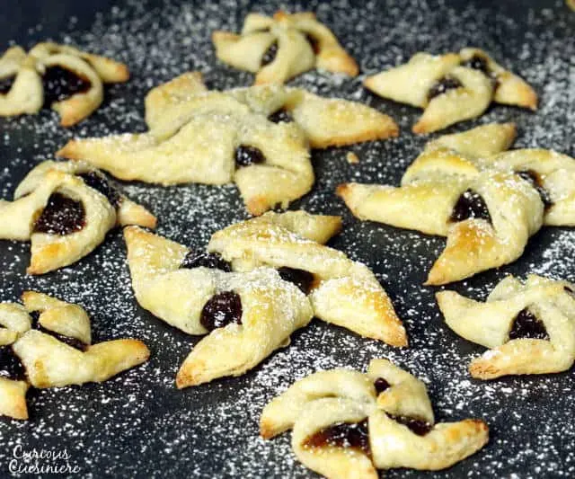Soft and flaky pasty surrounds a flavorful jam in Joulutorttu, festive Finnish Christmas Star Cookies. | www.CuriousCuisiniere.com