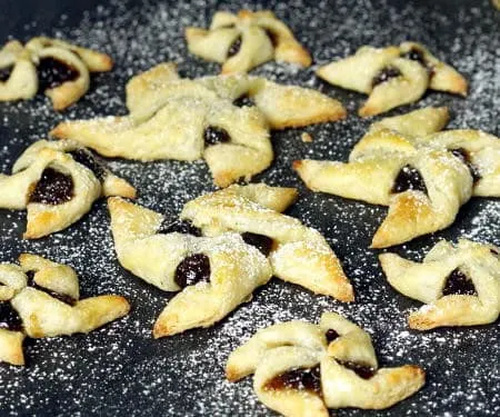 Soft and flaky pasty surrounds a flavorful jam in Joulutorttu, festive Finnish Christmas Star Cookies. | www.CuriousCuisiniere.com