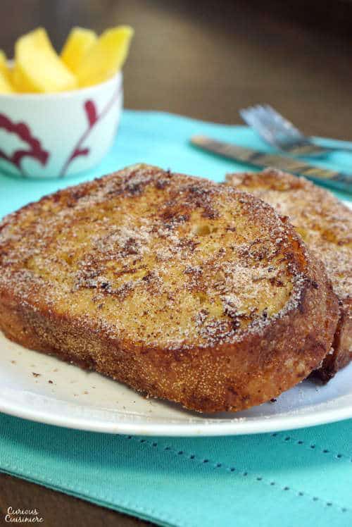 Crispy and cinnamony on the outside and custard-like on the inside, Rabanada, Brazilian French Toast is the perfect breakfast treat or desert at Christmas or any time of year! | www.CuriousCuisiniere.com