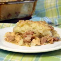 With a flavorful meat and veggie bottom and a crusty potato top, St Stephen's Day Pie might just become your new favorite way to eat leftovers! | www.CuriousCuisiniere.com