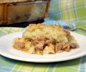 With a flavorful meat and veggie bottom and a crusty potato top, St Stephen's Day Pie might just become your new favorite way to eat leftovers! | www.CuriousCuisiniere.com
