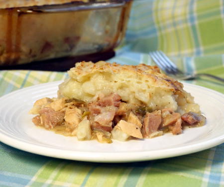 With a flavorful meat and veggie bottom and a crusty potato top, St Stephen's Day Pie might just become your new favorite way to eat leftovers! | www.CuriousCuisiniere.com