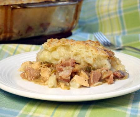 With a flavorful meat and veggie bottom and a crusty potato top, St Stephen's Day Pie might just become your new favorite way to eat leftovers! | www.CuriousCuisiniere.com