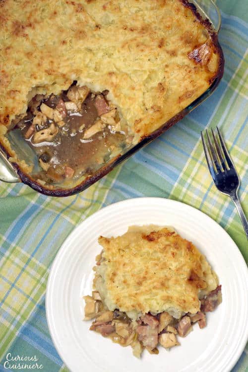 With a flavorful meat and veggie bottom and a crusty potato top, St Stephen's Day Pie might just become your new favorite way to eat leftovers! | www.CuriousCuisiniere.com