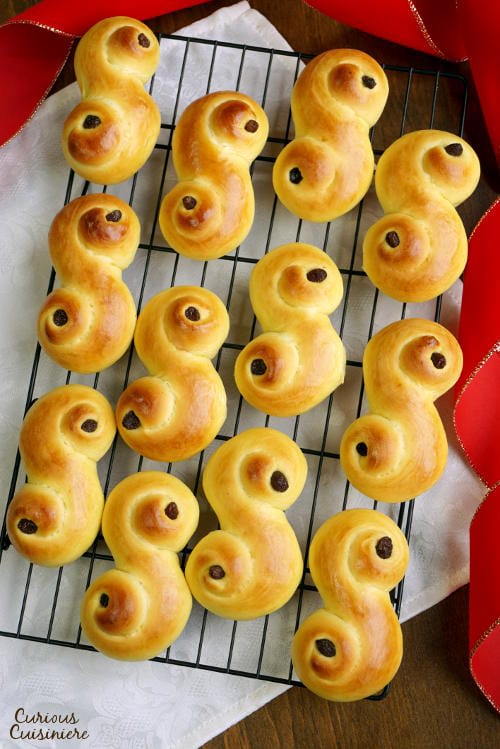 Light and fluffy Lussekatter are a fun to make treat for St. Lucia's Day and beyond. Celebrate the Christmas season with these Swedish Saffron Buns! | www.CuriousCuisiniere.com