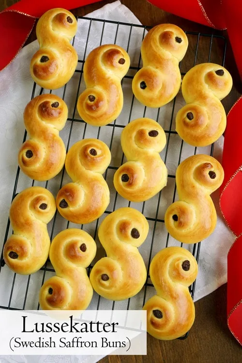 Light and fluffy Lussekatter are a fun to make treat for St. Lucia's Day and beyond. Celebrate the Christmas season with these Swedish Saffron Buns! | www.CuriousCuisiniere.com