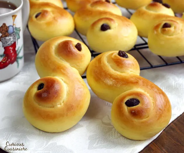 Light and fluffy Lussekatter are a fun to make treat for St. Lucia's Day and beyond. Celebrate the Christmas season with these Swedish Saffron Buns! | www.CuriousCuisiniere.com