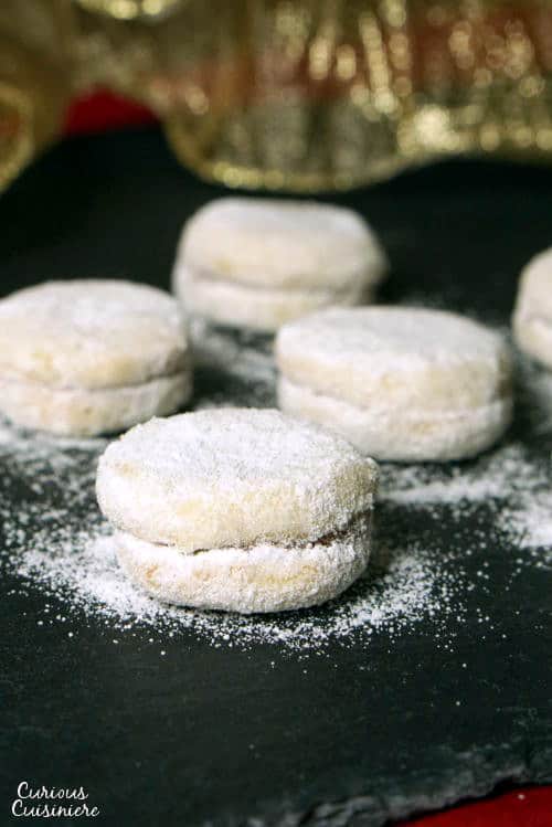 Vanilice are bite-sized Serbian Vanilla Cookies that are seriously addicting. With a nutty sweetness and a soft jam filling, they're the perfect recipe to add to your next cookie platter! | www.CuriousCuisiniere.com