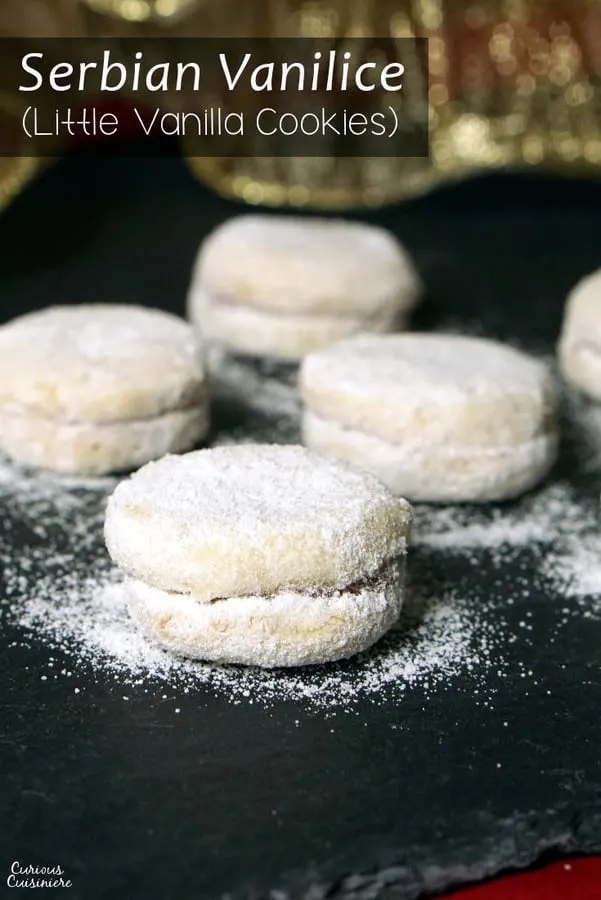 Vanilice are bite-sized Serbian Vanilla Cookies that are seriously addicting. With a nutty sweetness and a soft jam filling, they're the perfect recipe to add to your next cookie platter! | www.CuriousCuisiniere.com