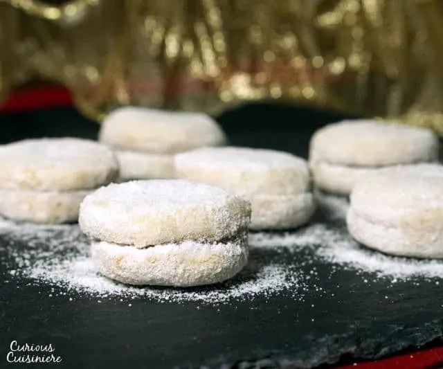 Vanilice are bite-sized Serbian Vanilla Cookies that are seriously addicting. With a nutty sweetness and a soft jam filling, they're the perfect recipe to add to your next cookie platter! | www.CuriousCuisiniere.com