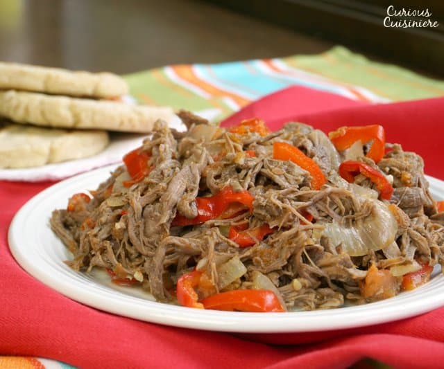Slow cooked, shredded beef takes on incredible flavor in this Venezuelan Carne Mechada. | www.CuriousCuisiniere.com